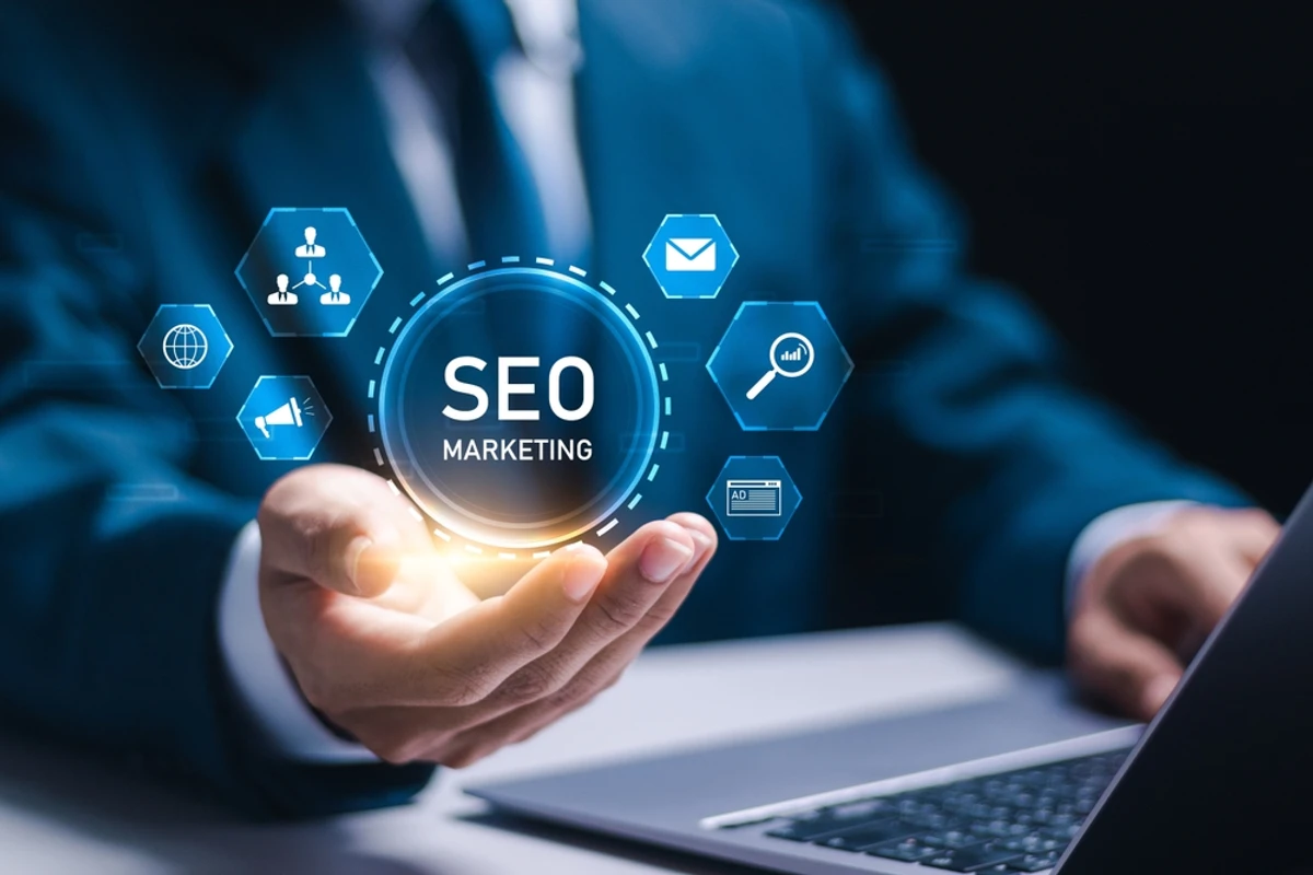 A businessman holding a glowing SEO marketing icon surrounded by smaller icons representing the different services included at each pricing tier